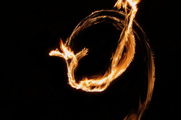 A 2-second exposure of a torch being spun, creating a circle of flame.